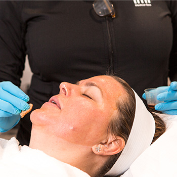 woman receiving facial treatment