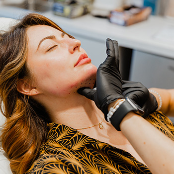 woman receiving injections under chin